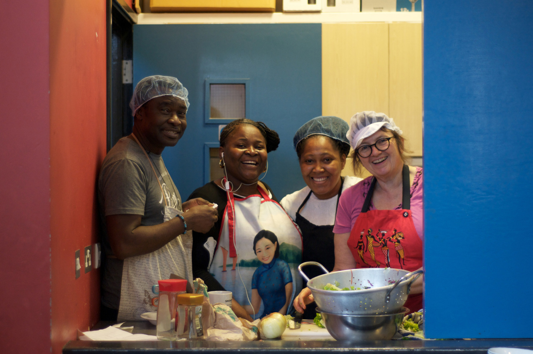 Volunteers cooking in the kitchen